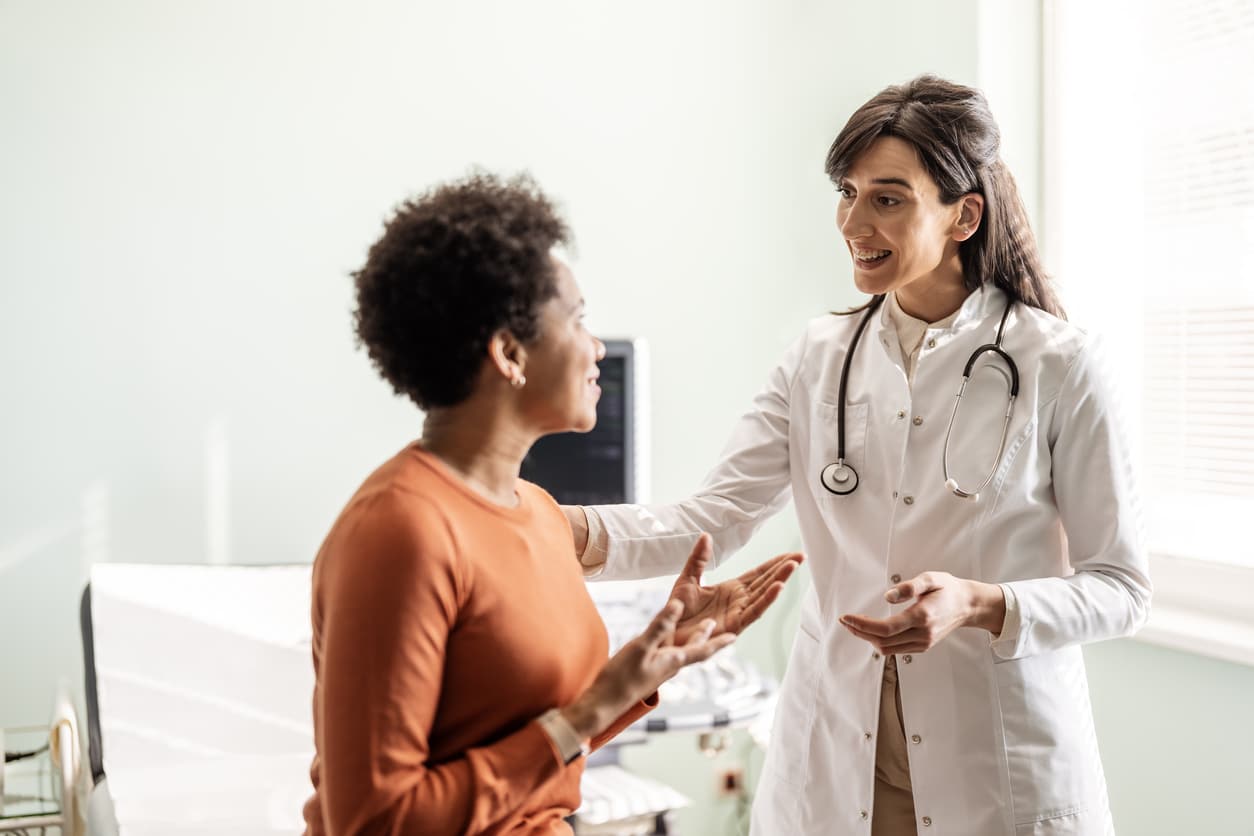 Audiologist discussing hearing health with a patient