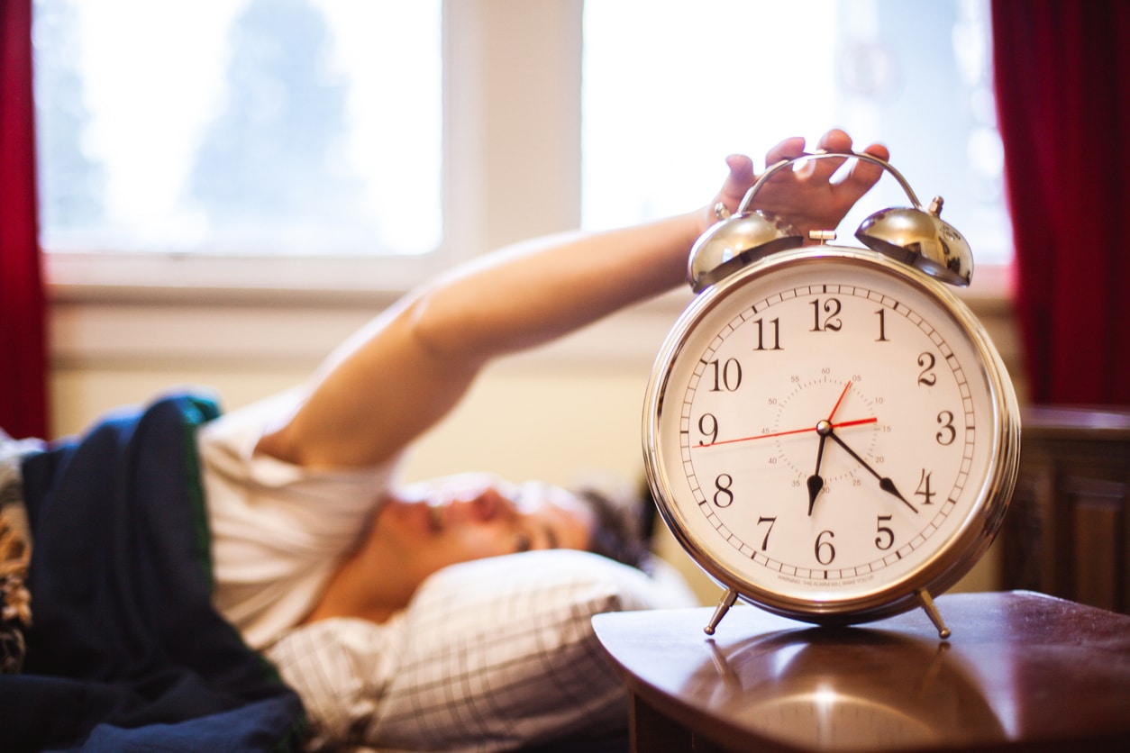 Woman turning off her alarm